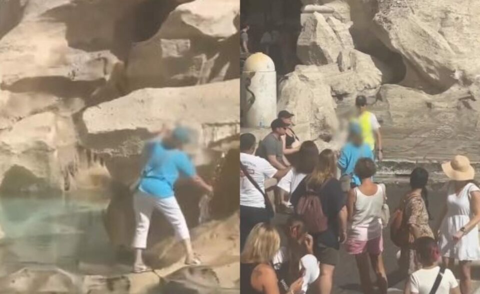 Жена е снимена како шета низ фонтаната ди Треви во Рим за да го наполни своето шише со вода